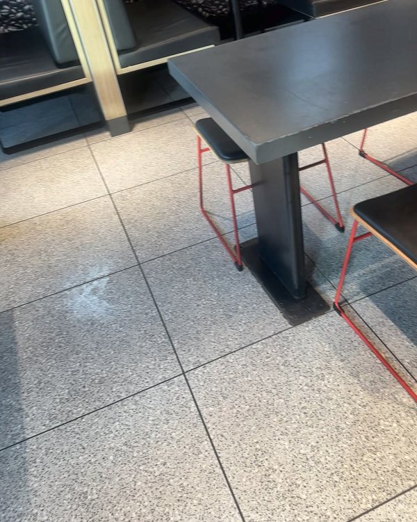 Restaurant dining room with booths and tables after cleaning